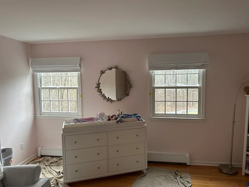 SIngle paned double hung windows in Wilton, CT make the baby's bedroom cold